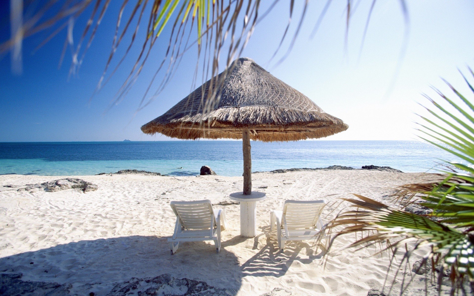 sea and ocean beach ocean seashore water sea resort sand vacation travel tropical summer relaxation island paradise sky idyllic chair sun exotic