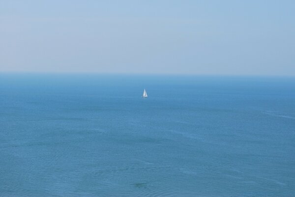 A ship on the high seas. Blue background