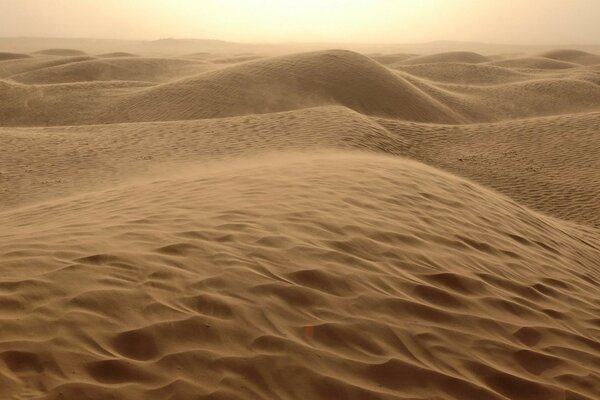 Brown hills in the desert and a piece of sky