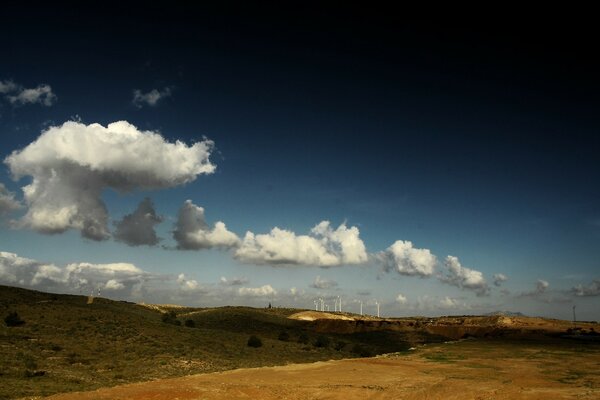 Wind farm on the hills against the sky