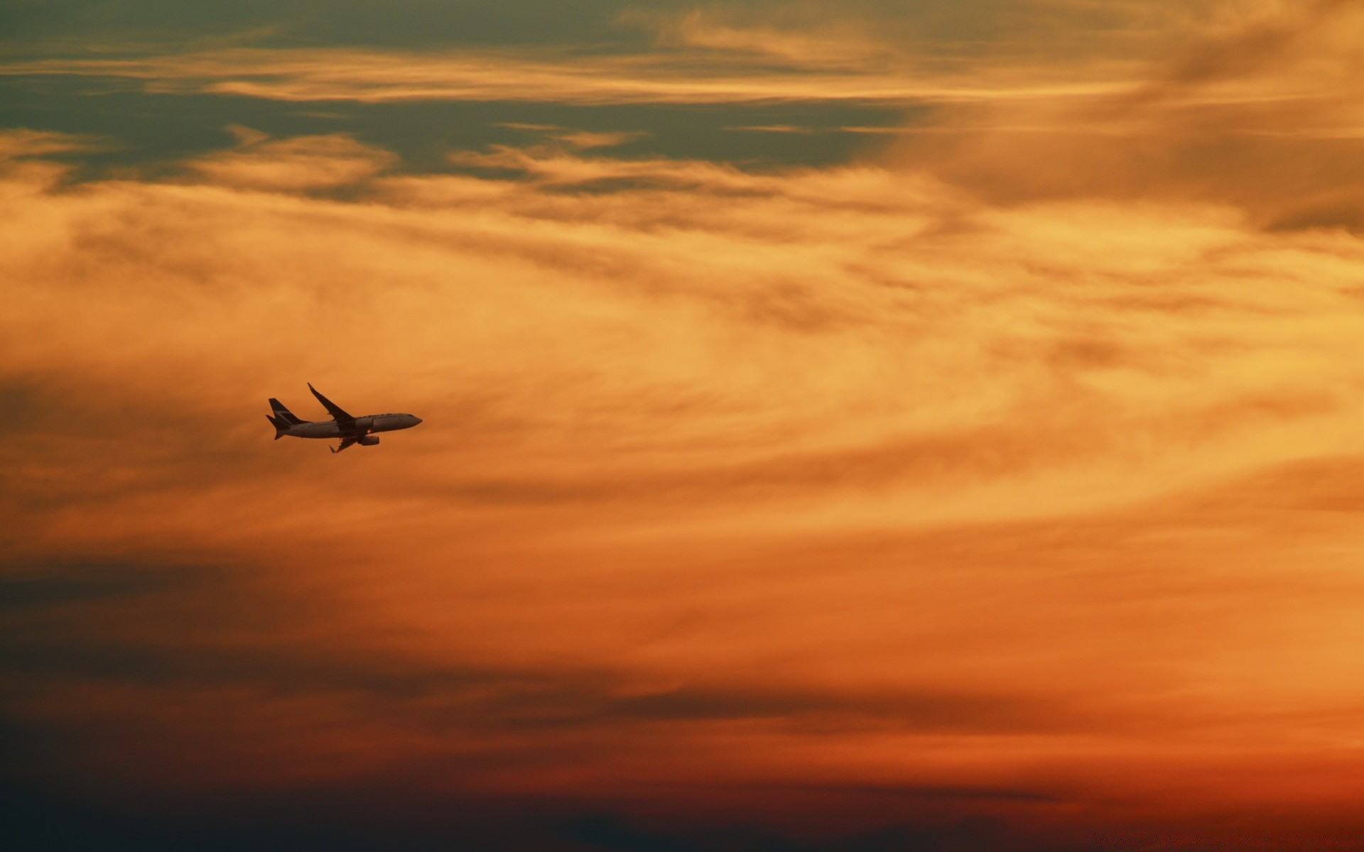 the sky sunset sky dawn sun evening airplane flight dusk backlit silhouette fair weather outdoors nature aircraft cloud weather dramatic light