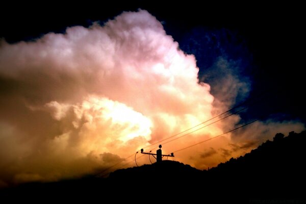 Power line on the background of a cloudy sky