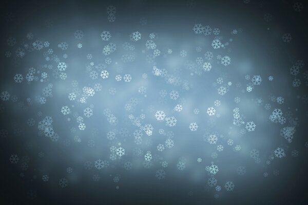 Falling snowflakes in the dark sky