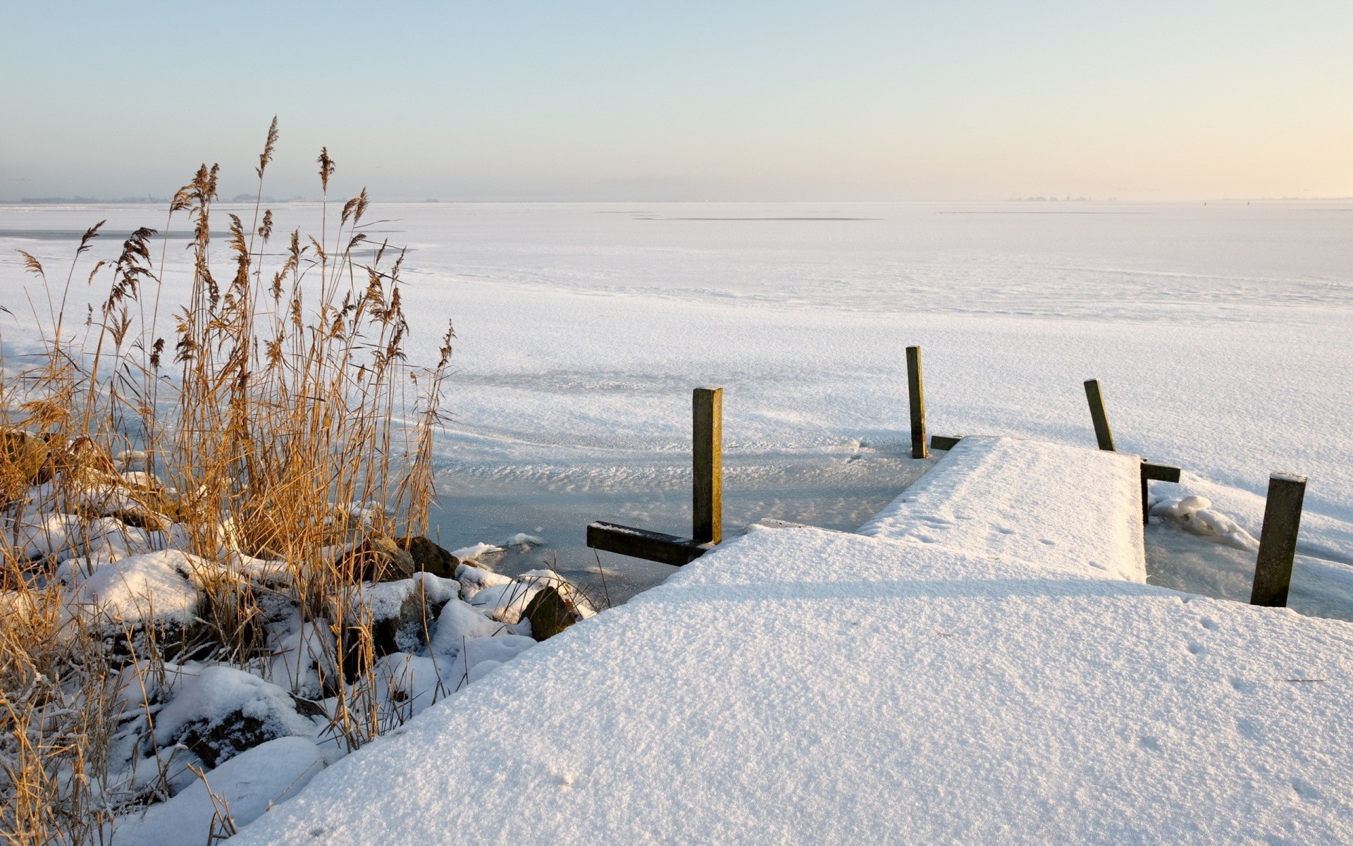 winter snow water frost cold ice beach sea frozen nature landscape sky travel outdoors seashore ocean lake fair weather weather