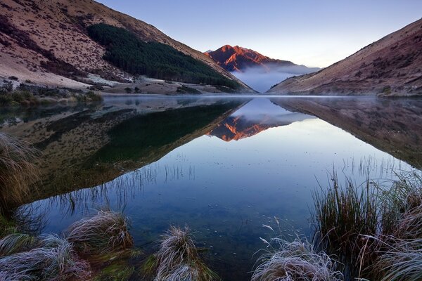 Landscape of mountains and lakes against a clear sky