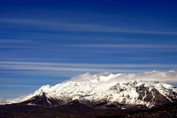 Snow on the top of the mountains on the background
