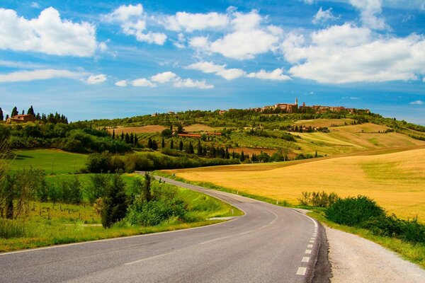 A road in the countryside among the golden hills