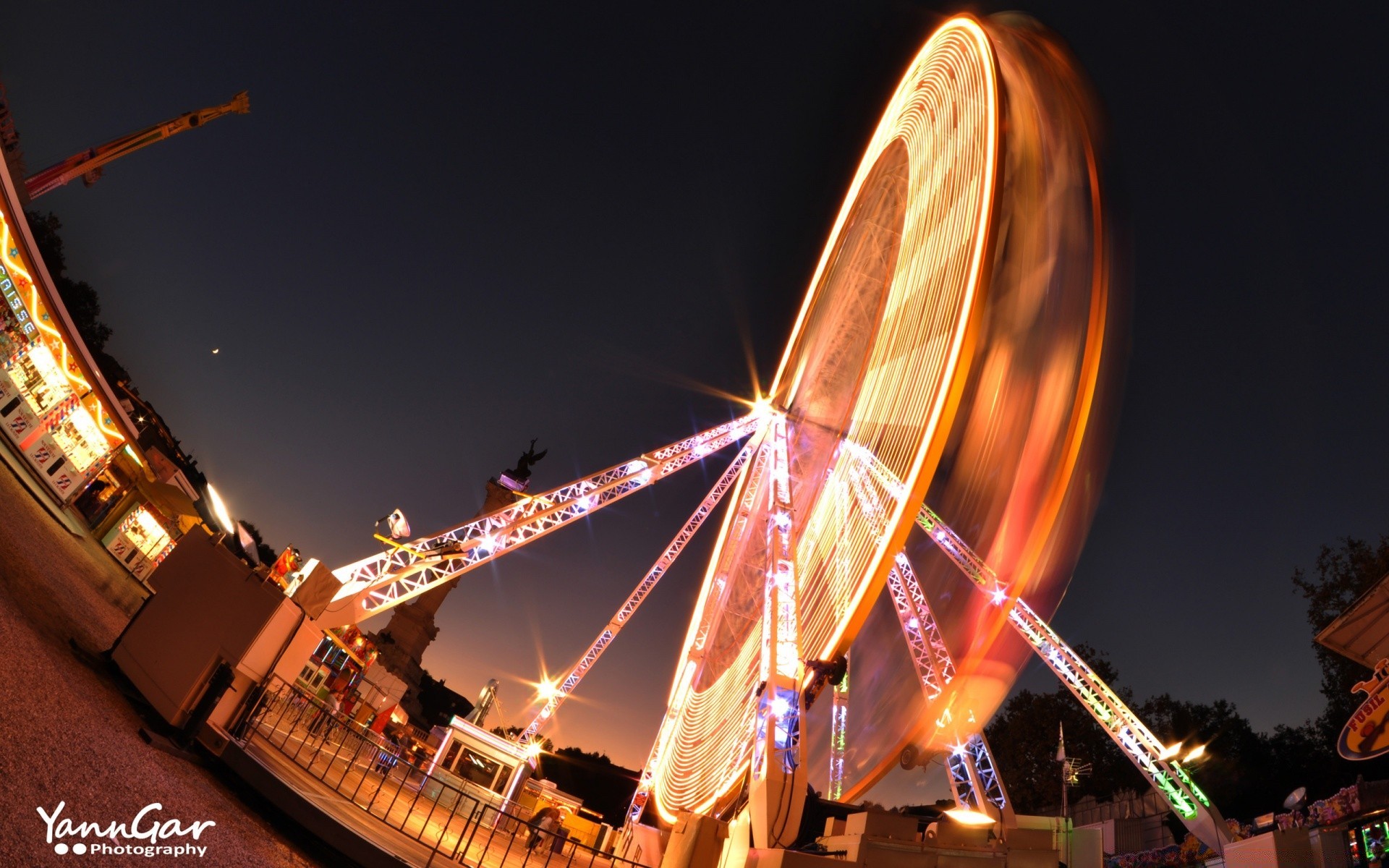 europe ferris wheel festival carousel fun evening exhilaration carnival travel illuminated light circus entertainment fairground casino dark