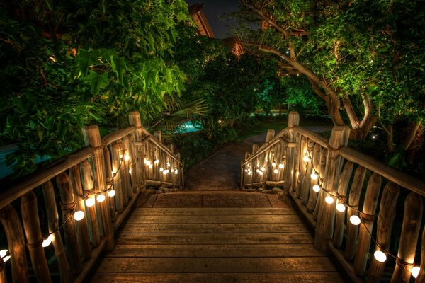 Romantic bridge with lanterns at night